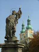 Statue and church spires on the main square of Hradec Kralove