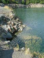 Rocks beneath the water in the Vykleky quarry